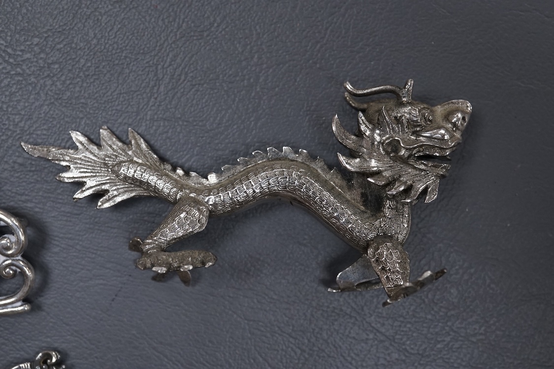 A group of small collectable silver including a white metal dragon menu holder? by Wang Hing, 92mm, two 19th century caddy spoons, three assorted belt buckles and a 1920's silver and enamel pill box(a.f), import marks fo